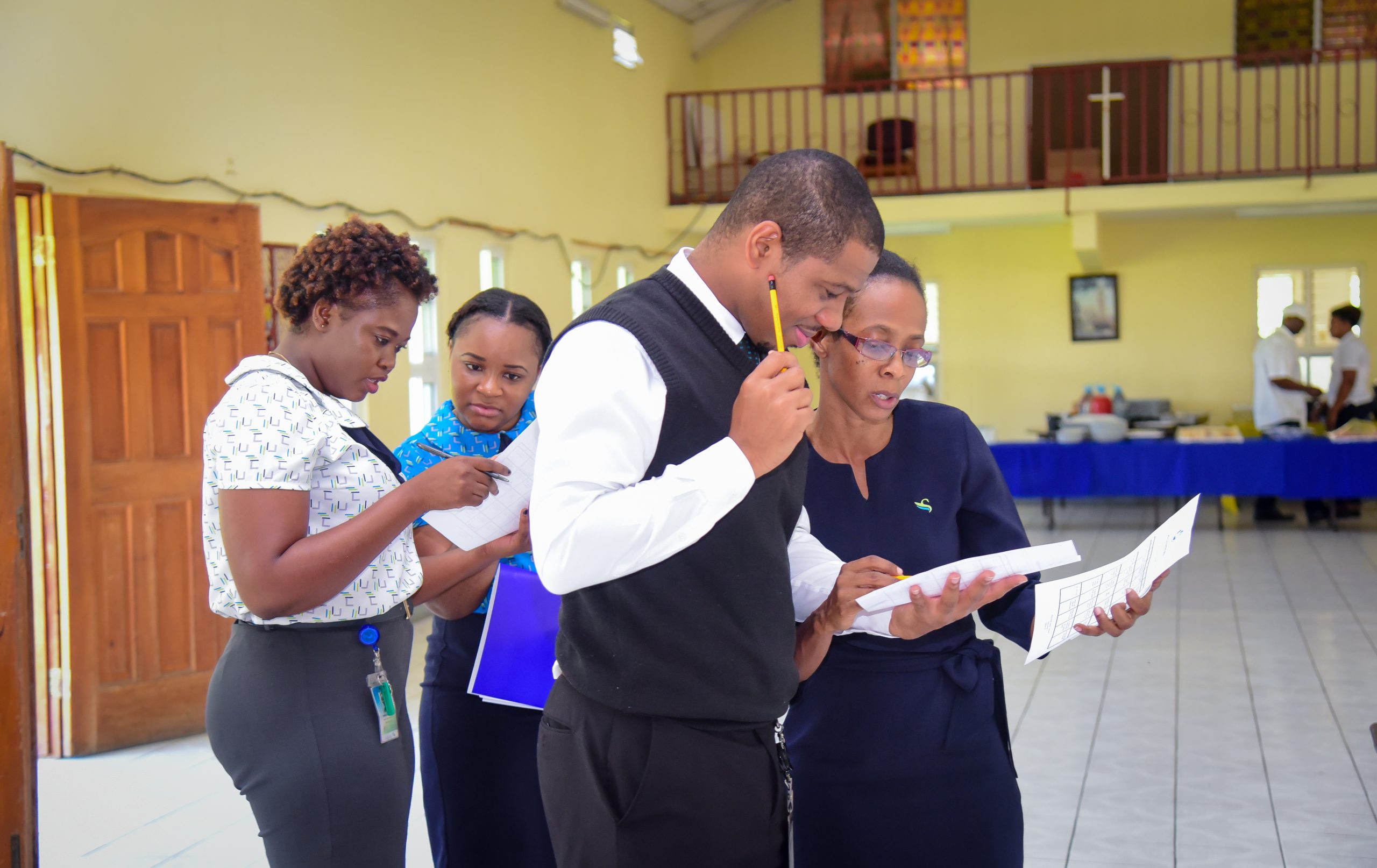Policyholder staff from Western Jamaica engaged in discussion during a training session on the
Deposit Insurance Scheme